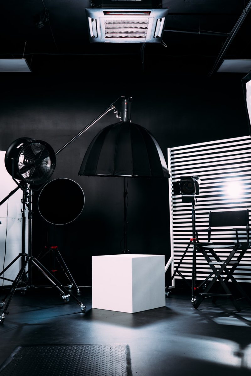 Modern photo studio with professional equipment. Black cyclorama.